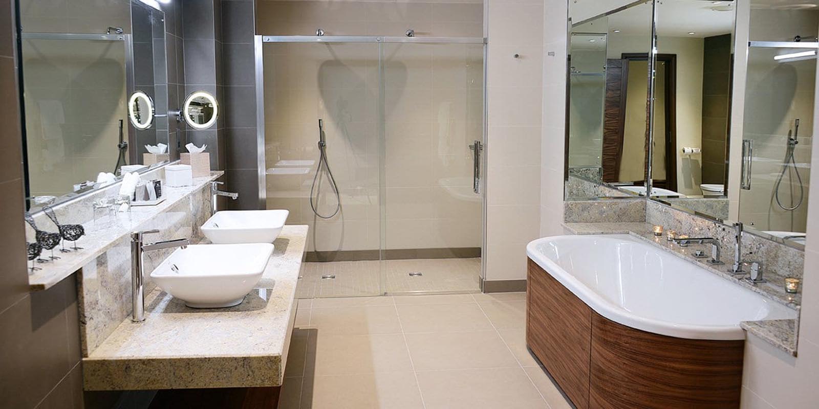 Bathroom with twin sinks, bath and walk in shower