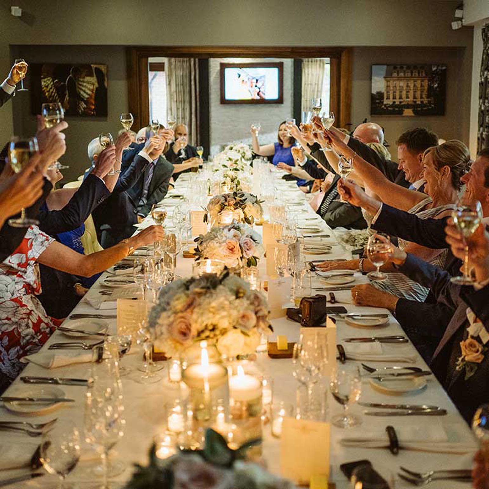 Guests raising a glass in the private dining area