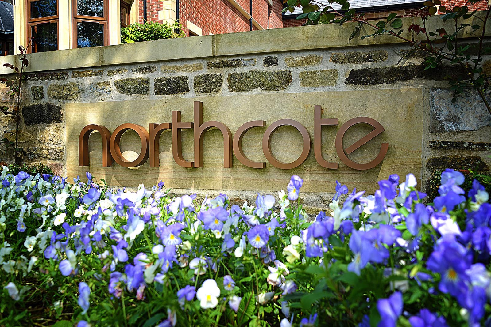Northcote sign with flowers