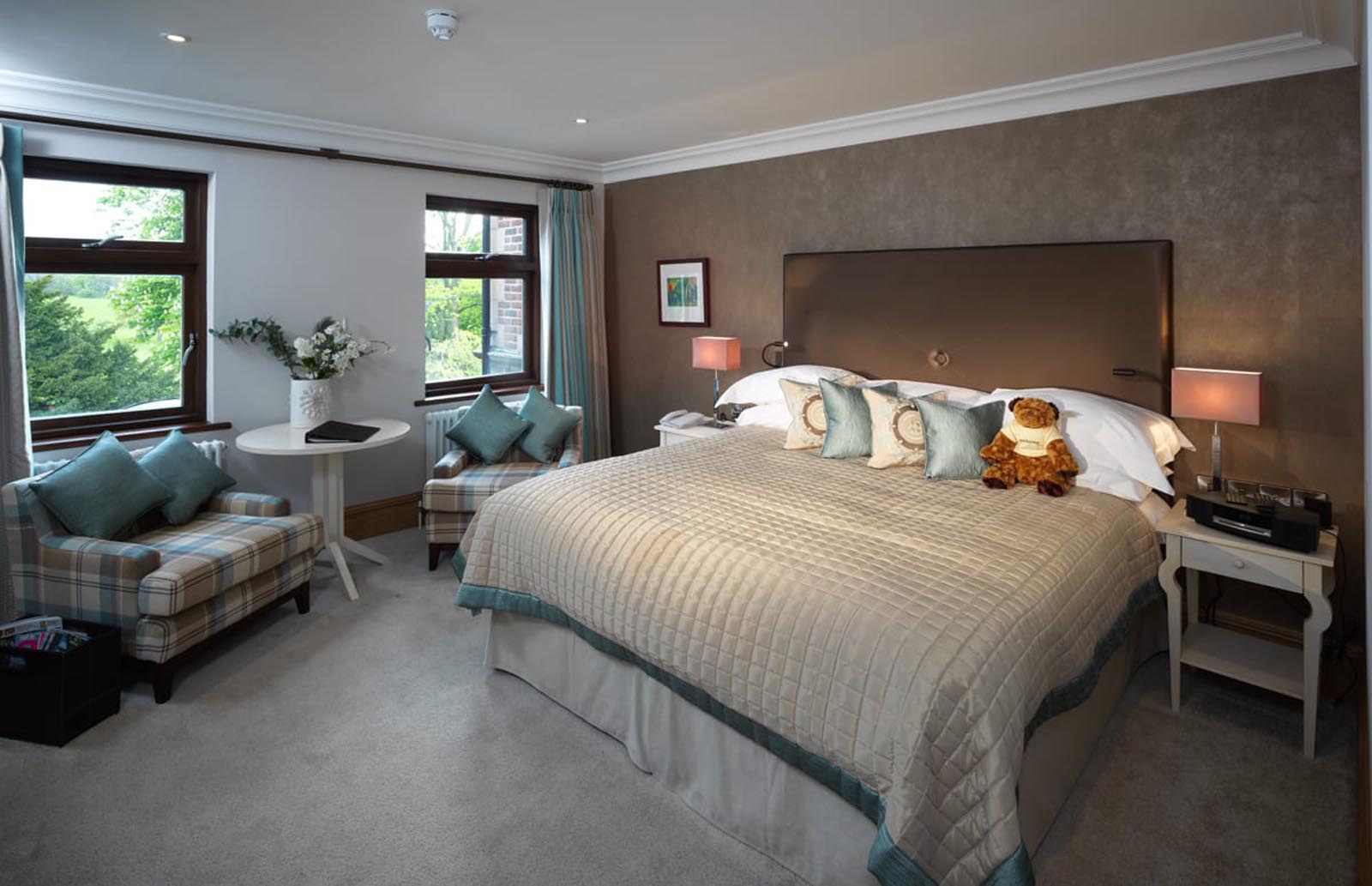 A large double bed and seating area